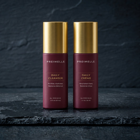 PREIMELLE ORIGIN System: Daily Cleanser and Daily Crème on dark slate